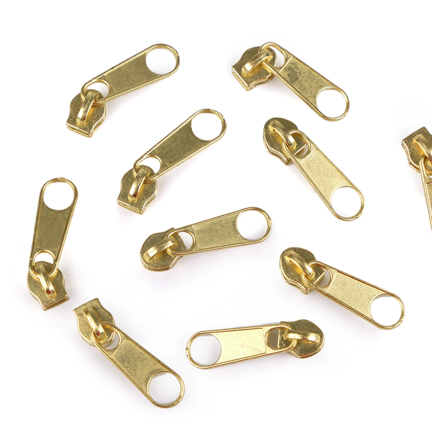 Reißverschluss-Schieber 3mm in Gold aus Metall – Hochwertiger, glänzender Zipper ohne Arretierung für Spiralreißverschlüsse. Korrosionsbeständig und elegant.