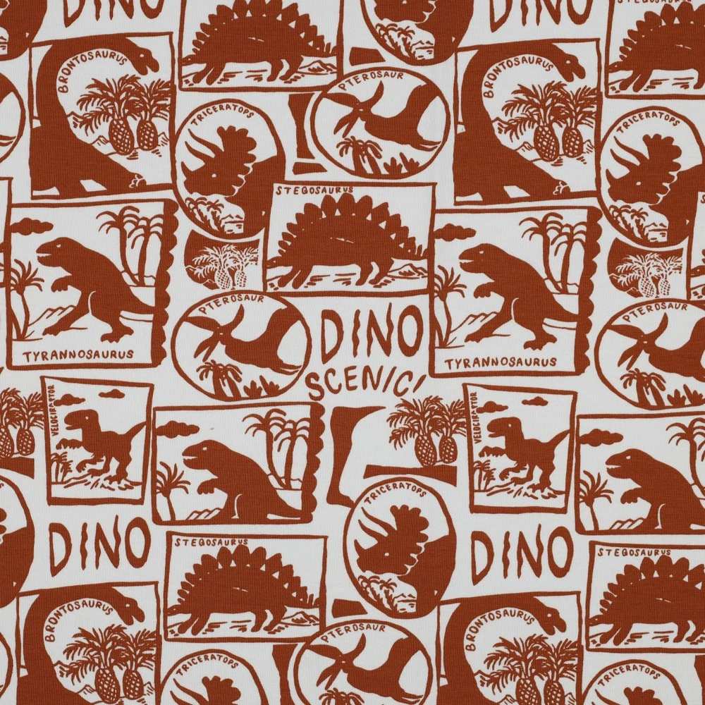 Hochwertiger Motivjersey mit Dinosaurier-Skeletten und Fossilien auf rostfarbenem Grund, elastischer Baumwolljersey, 200g/m², blickdichter Stoff für Kinderbekleidung