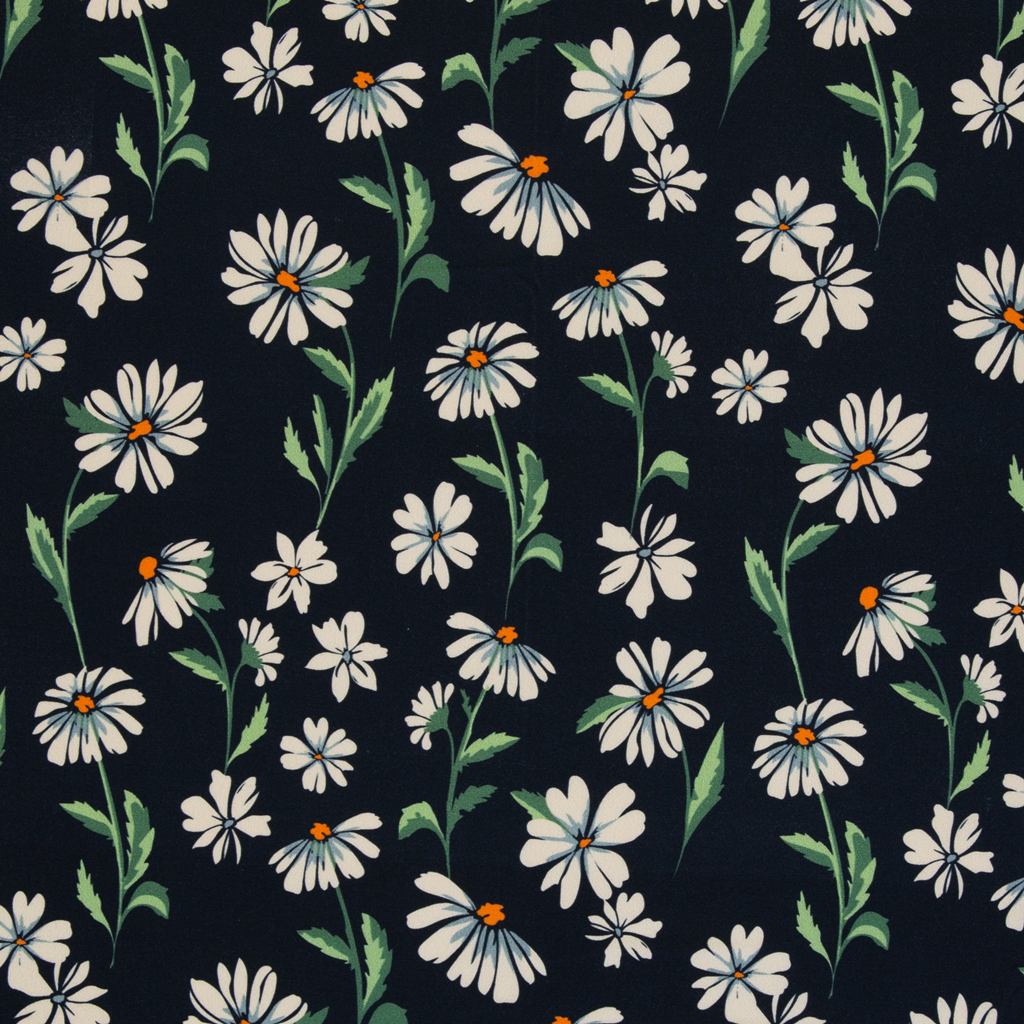 Swafing Viskosejersey Sizilien mit filigranen Gänseblümchen auf dunklem Hintergrund.